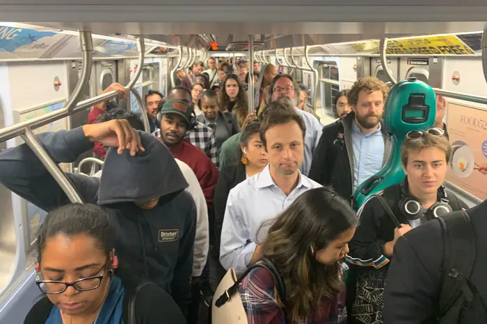 The scene from a stalled crowded A Train on Friday evening.